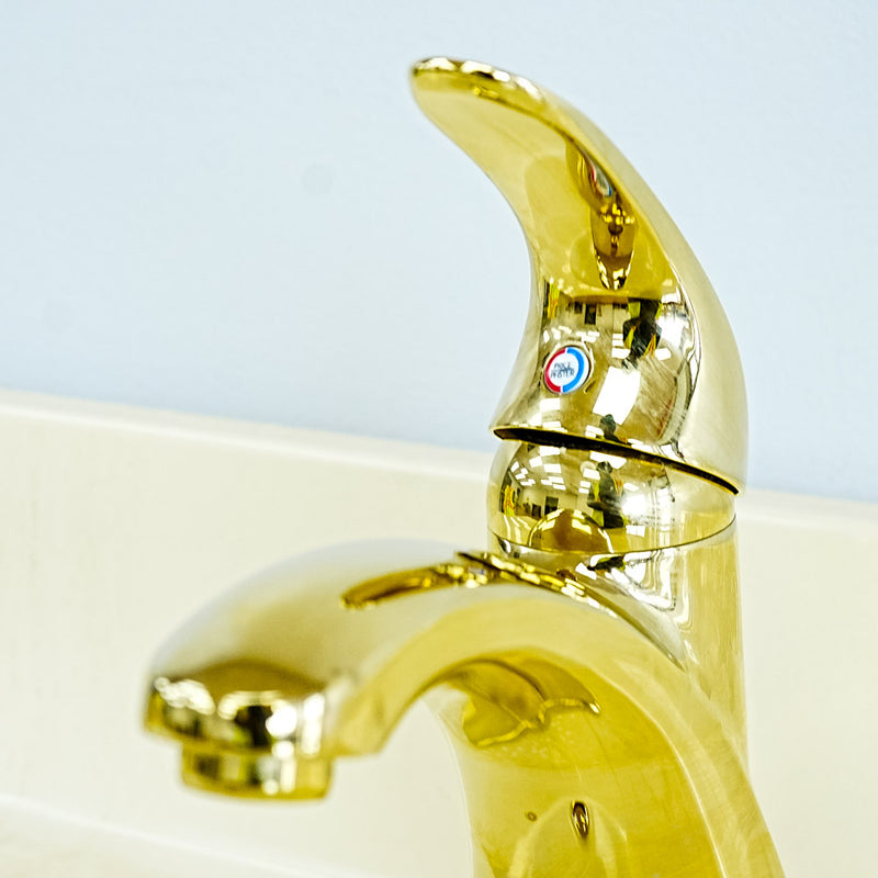 White Bathroom Vanity with Yellow Countertop, Gold Faucet, and Sink