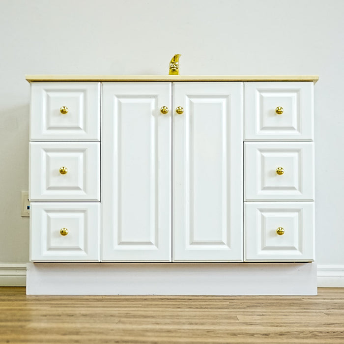 White Bathroom Vanity with Yellow Countertop, Gold Faucet, and Sink