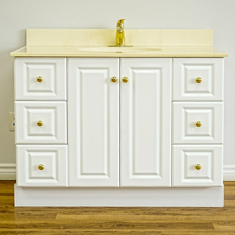 White Bathroom Vanity with Yellow Countertop, Gold Faucet, and Sink