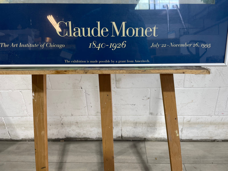 26"W Claude Monet painting with silver frame