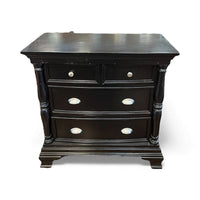 Black Dresser With Carved Detailing