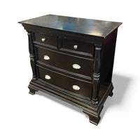 Black Dresser With Carved Detailing