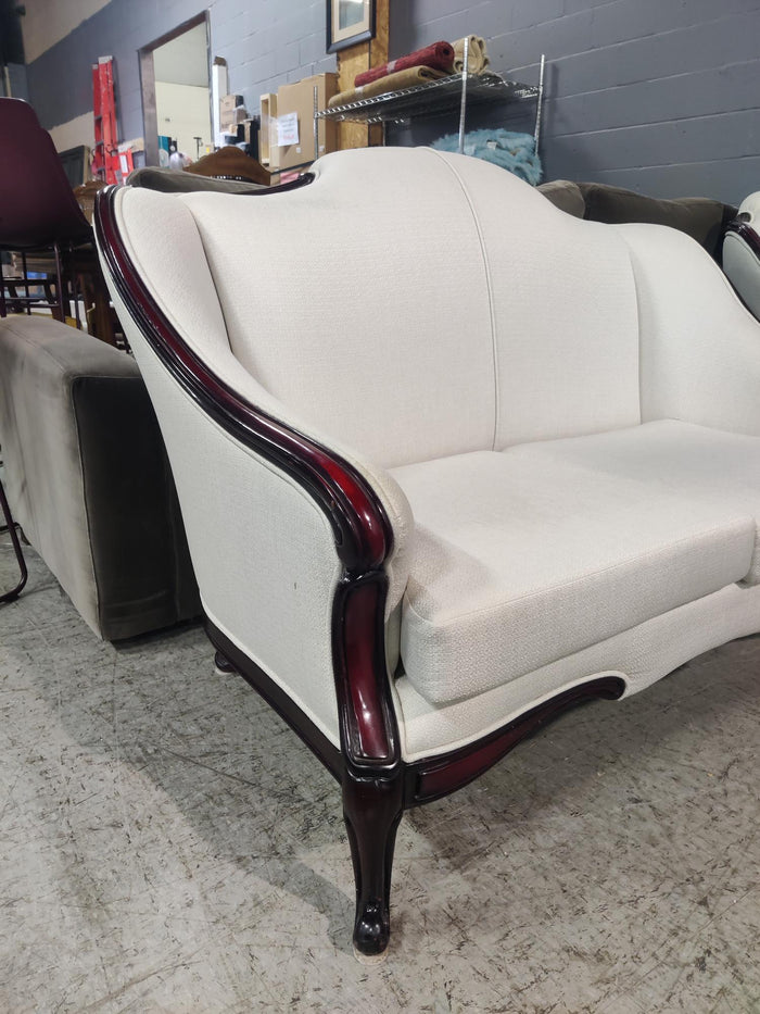 White Loveseat with Deep Red Wood Frame