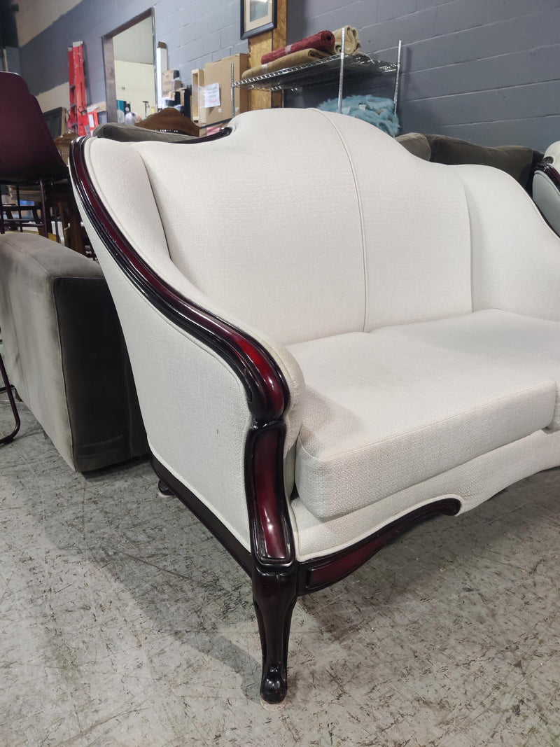 White Loveseat with Deep Red Wood Frame