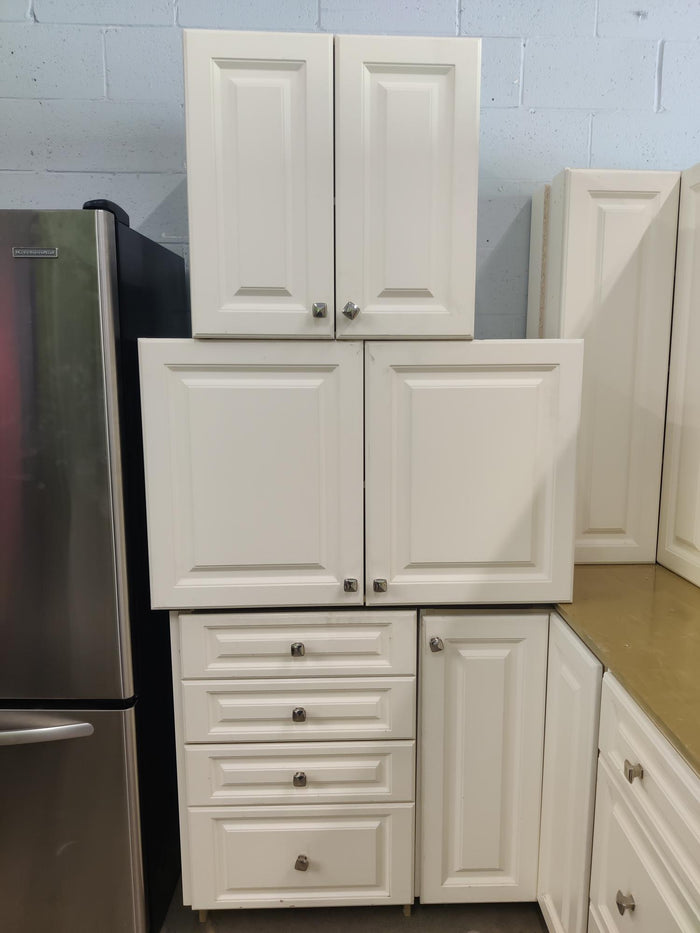 White Raised Panel Kitchen with Square Knobs