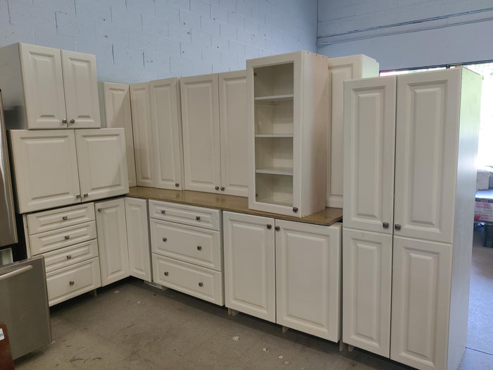 White Raised Panel Kitchen with Square Knobs