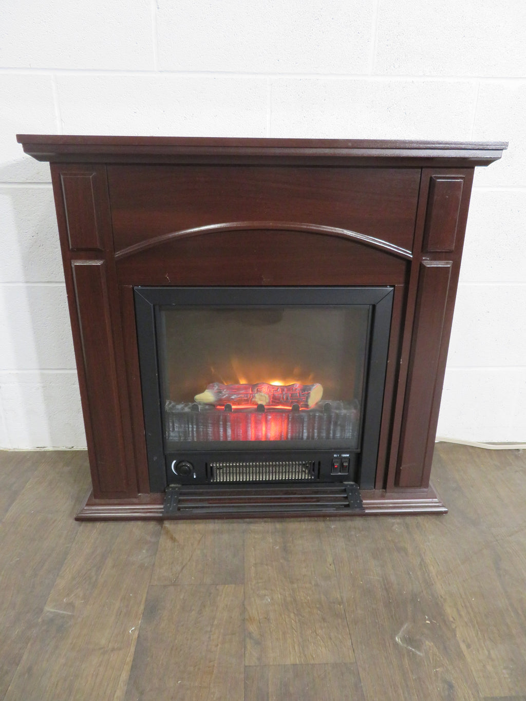 Small Electric Fireplace and Wooden Mantel