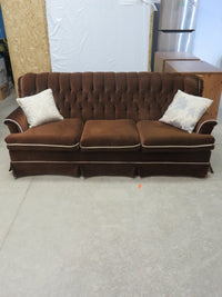 Vintage-style brown velvet sofa