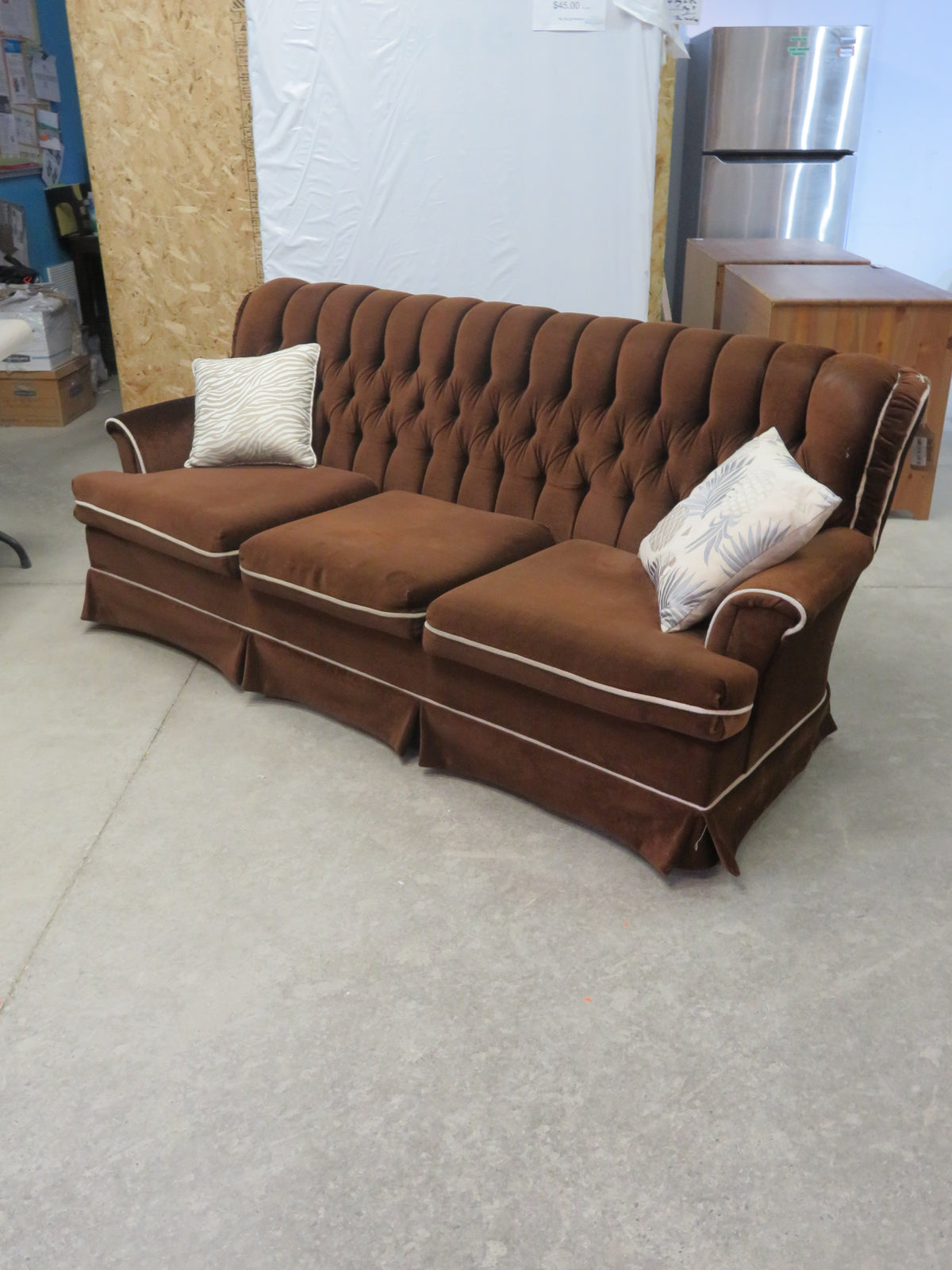Vintage-style brown velvet sofa