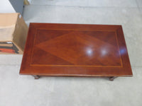 Traditional-style wood coffee table