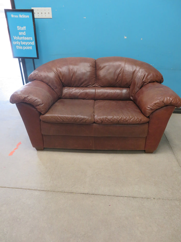 Brown leather loveseat