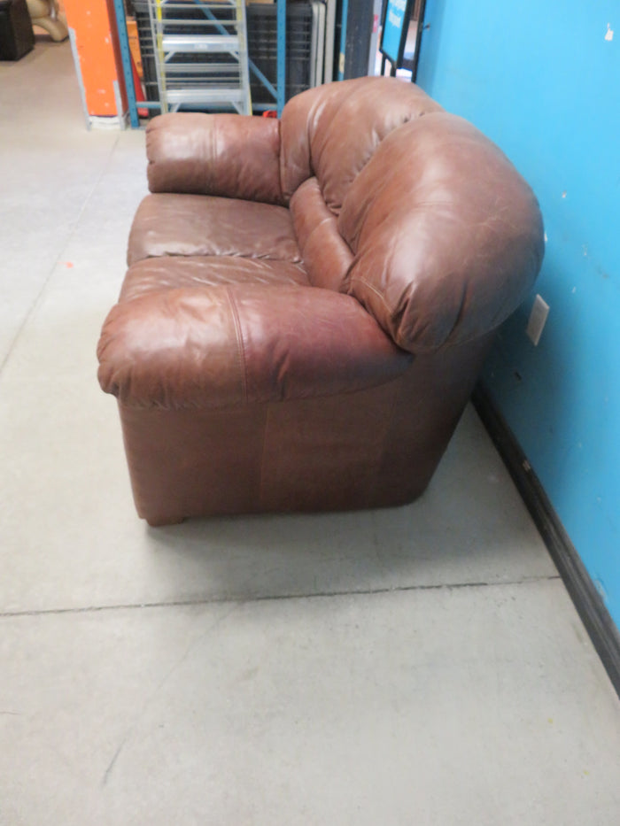 Brown leather loveseat