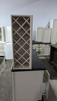 Beige Kitchen w/ Brown Island & Black Granite Countertops