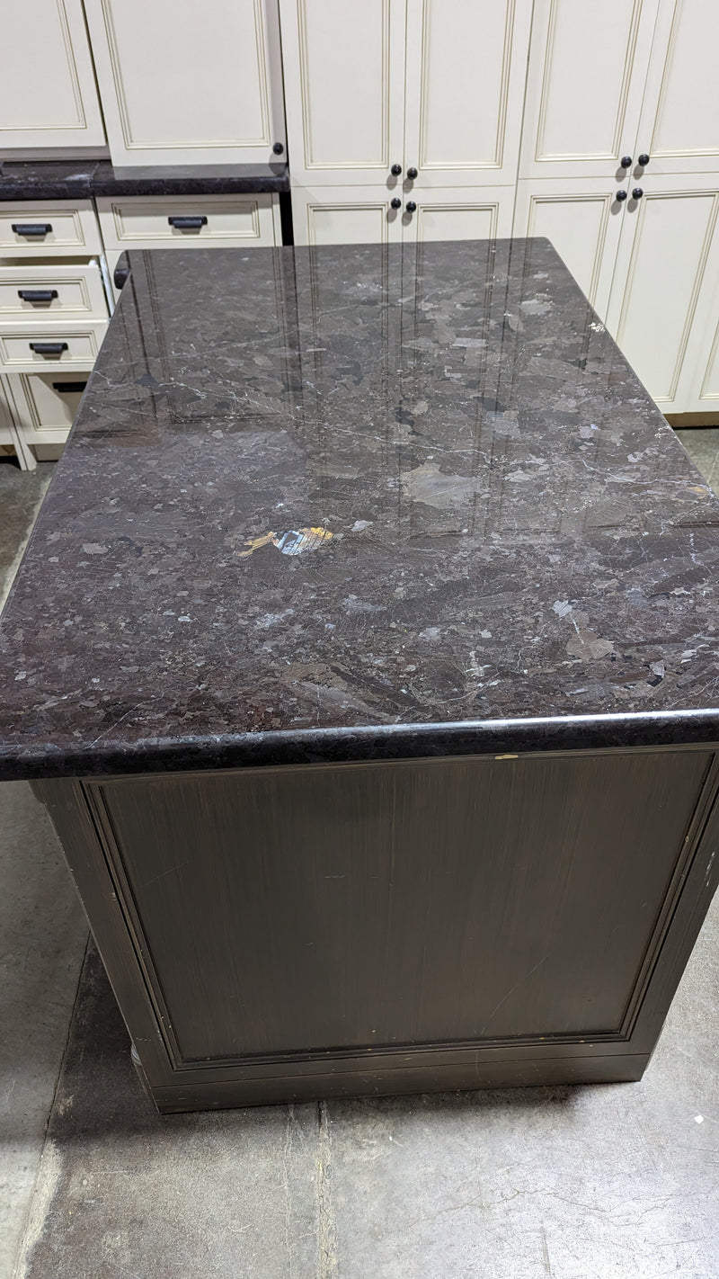 Beige Kitchen w/ Brown Island & Black Granite Countertops