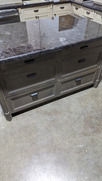 Beige Kitchen w/ Brown Island & Black Granite Countertops