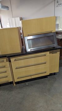 Angled Honey Maple Kitchen with Black Stone