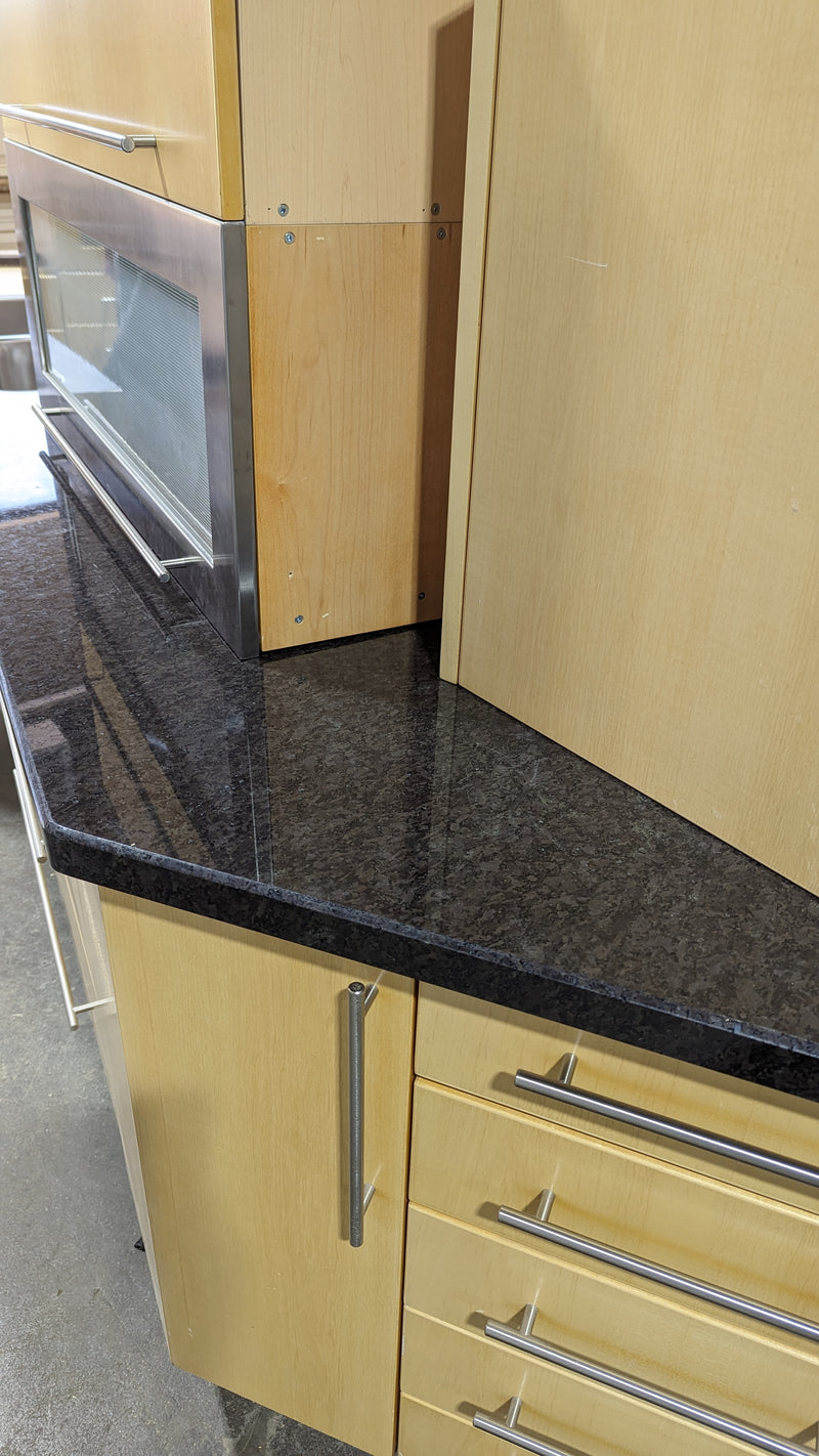 Angled Honey Maple Kitchen with Black Stone