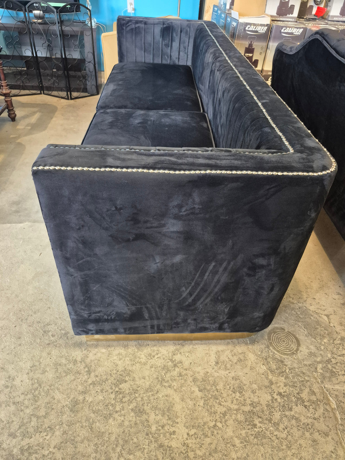 Black Velvet Sofa with Silver Nail Head Accents with Gold Base Trim