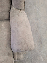 Beige Upholstered Wingback-Style Armchair