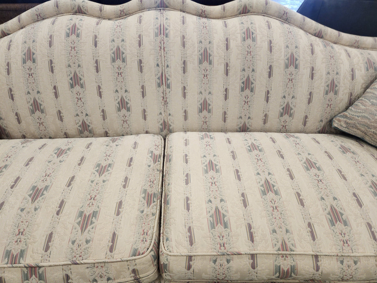 Camelback Floral Sofa with 2 Decorative Cushions