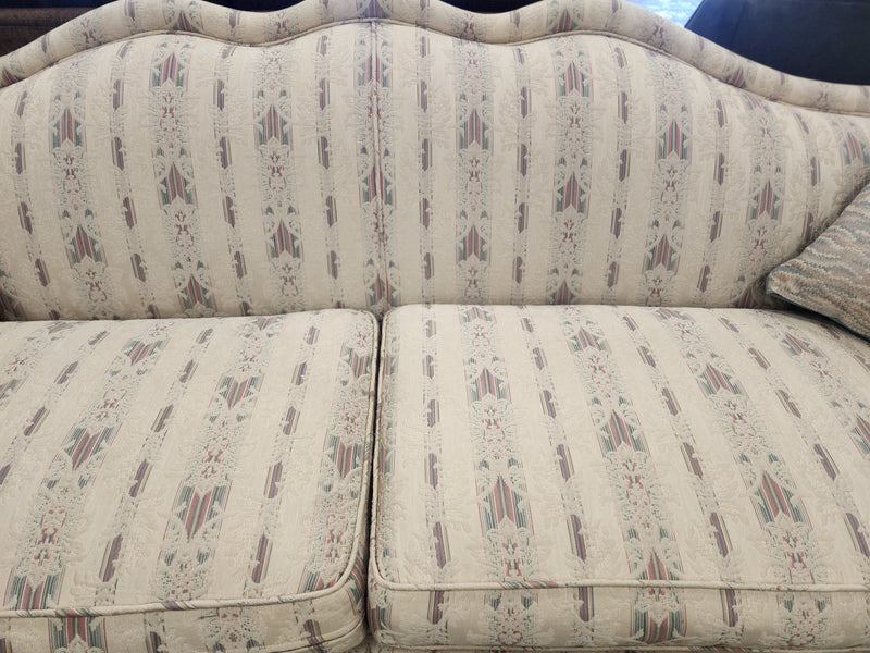 Camelback Floral Sofa with 2 Decorative Cushions