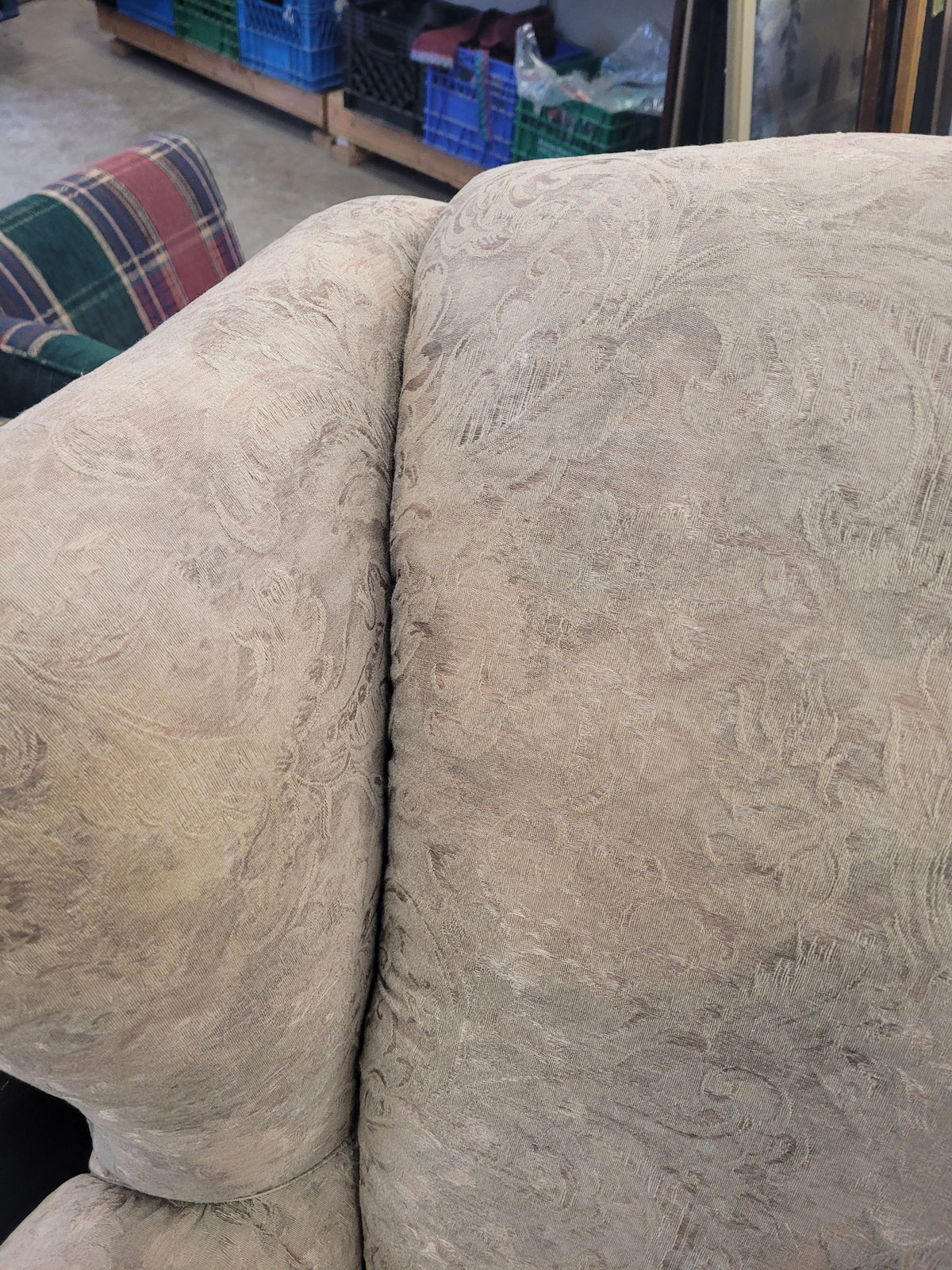 Beige Upholstered Wingback-Style Armchair