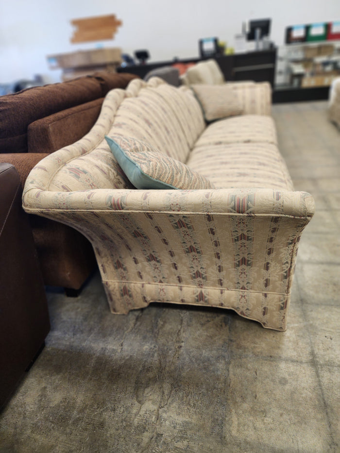 Camelback Floral Sofa with 2 Decorative Cushions